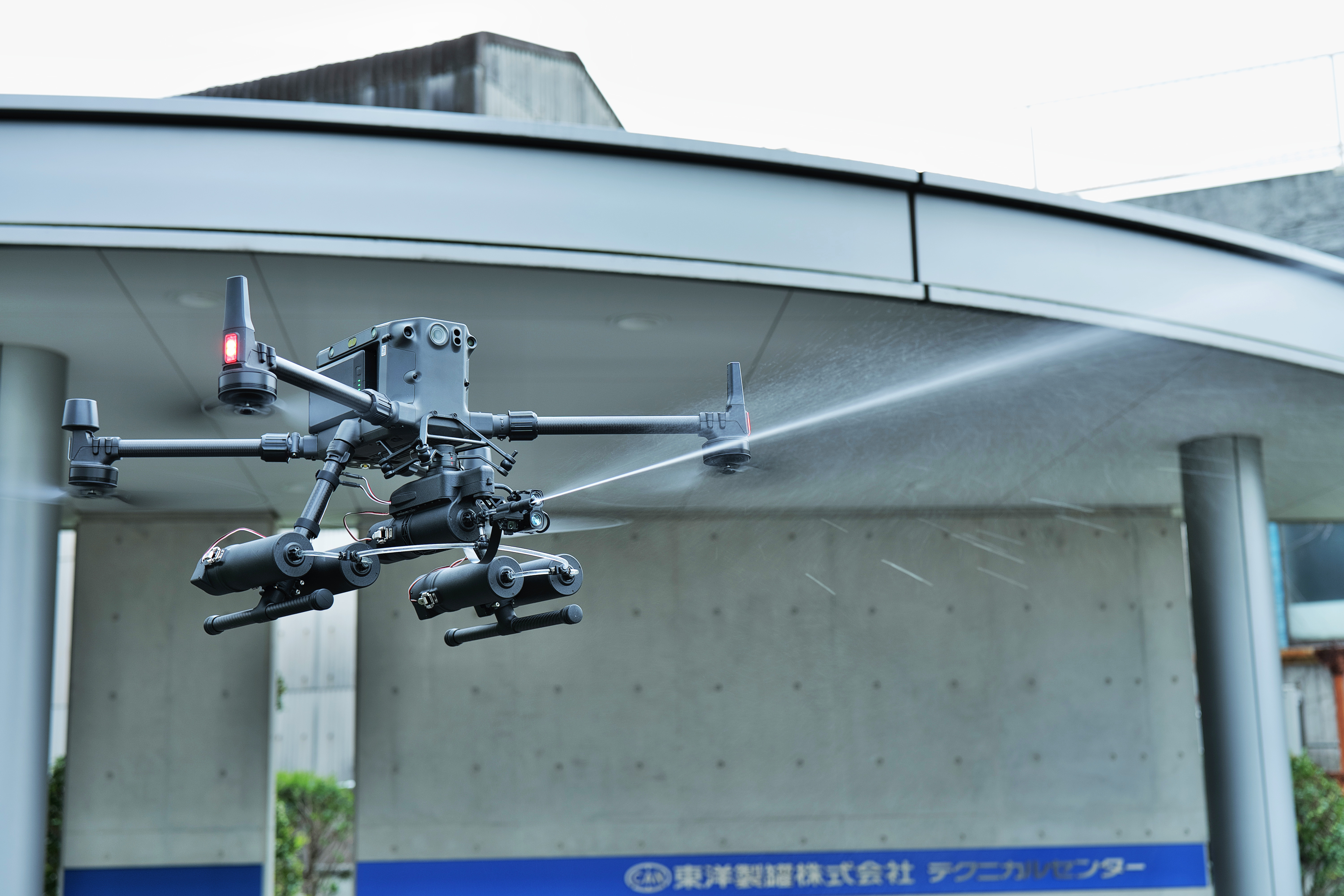 A drone installed with SABOT-3 at work during spraying